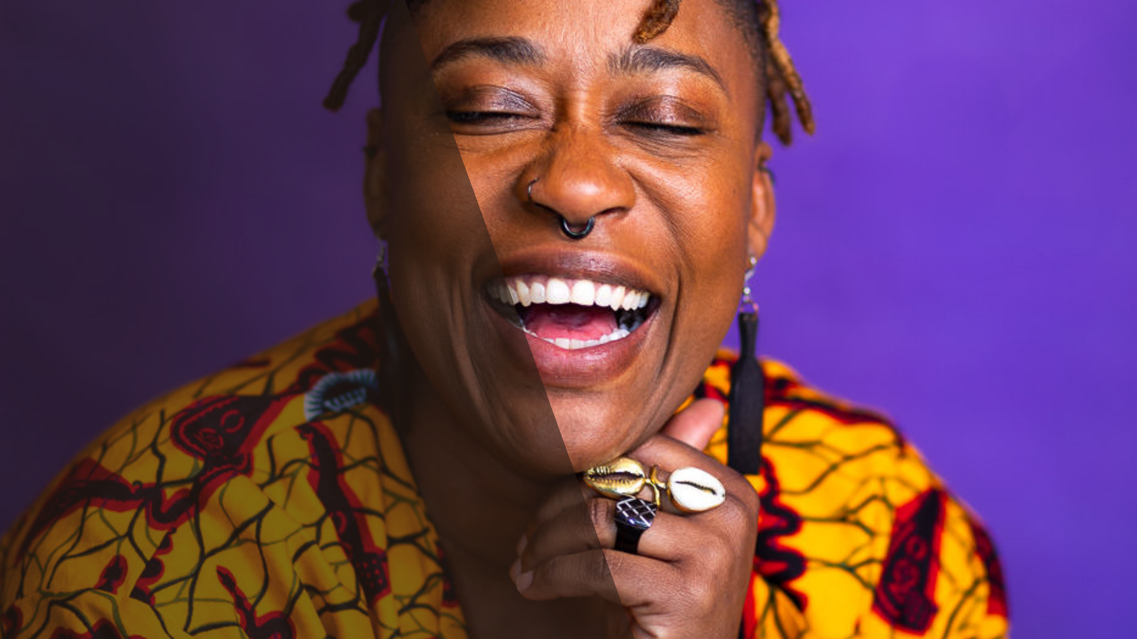 Person wearing a colorful patterned outfit with a purple background