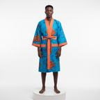 Man wearing a blue and orange patterned robe on a white background