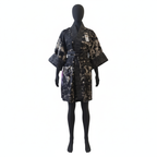 Black and white patterned robe on a mannequin against a white background