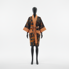 Mannequin wearing a patterned robe with a large bow on a white background