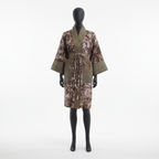 Camouflage-patterned robe on a mannequin against a white background