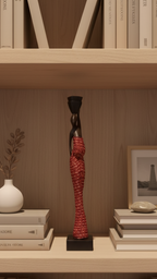 Decorative statue on a bookshelf with books and a plant
