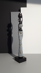 Decorative sculpture on a black stand against a gray background