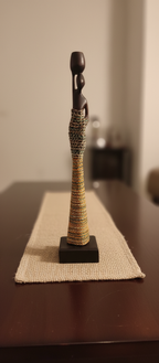 Decorative sculpture with a textured base on a table