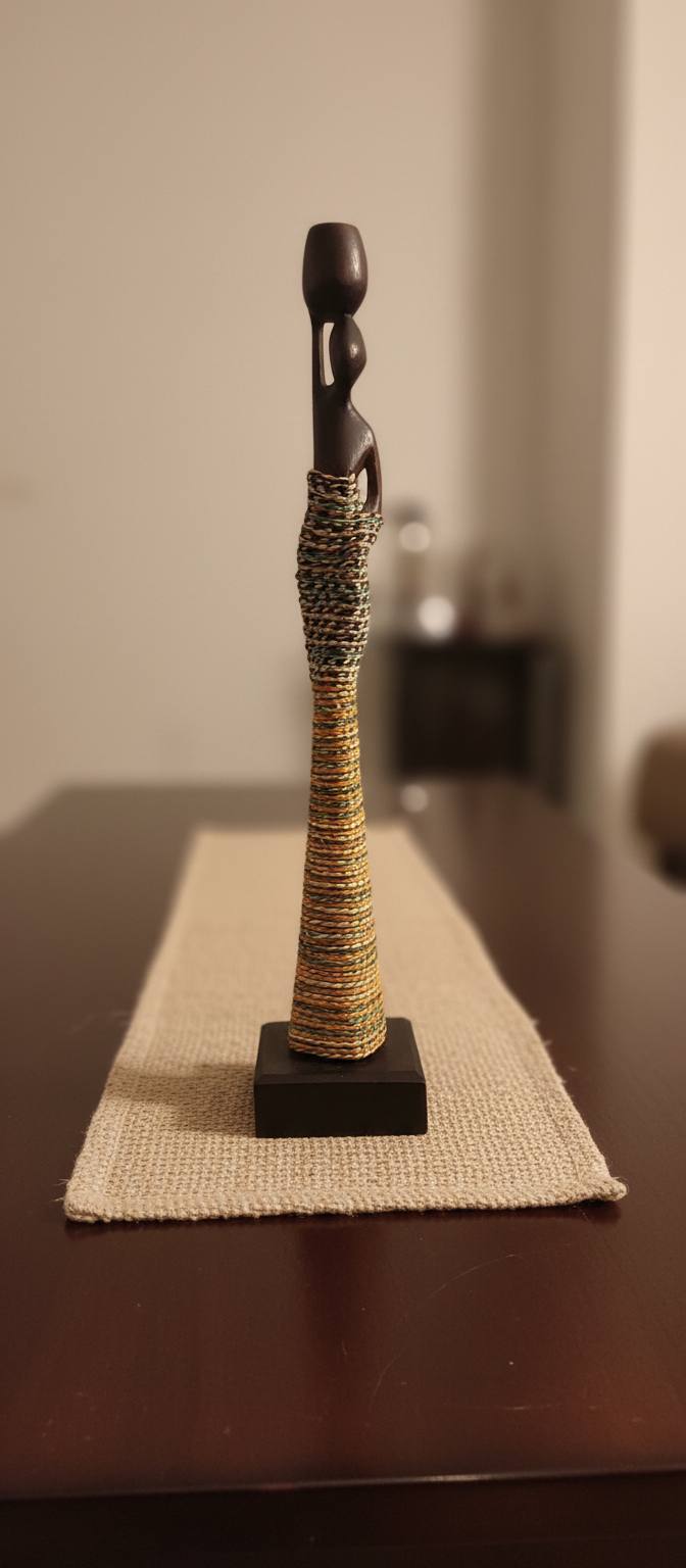 Decorative sculpture with a textured base on a table