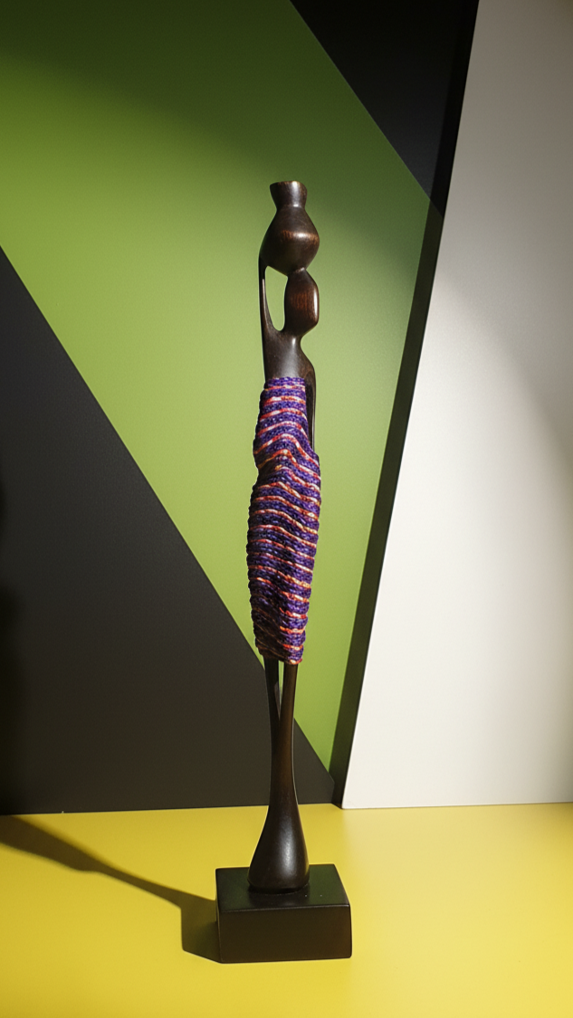 Decorative sculpture with a purple and black design on a yellow surface