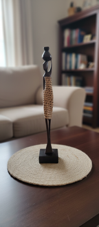 Decorative statue on a round mat in a living room setting