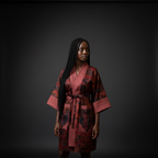 Woman wearing a red and black patterned kimono against a dark background